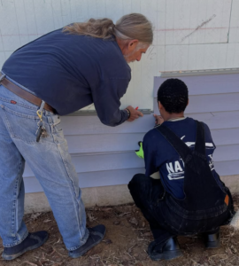 Students performed construction tasks, like flooring, siding installation, trim and finish work, painting and landscaping.